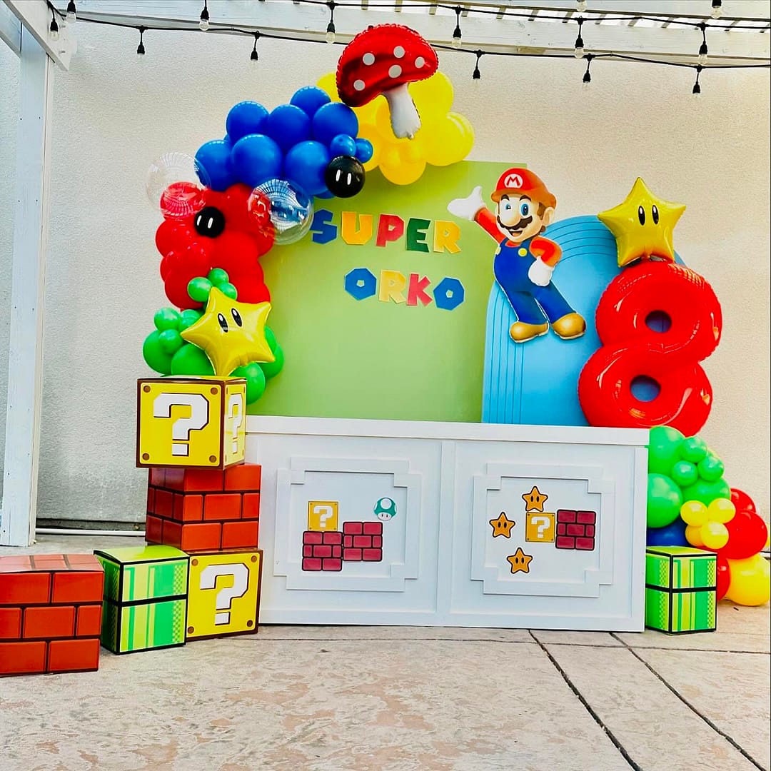 Party backdrop of Orko with Mario with balloons and creative shapes by Mellow Events