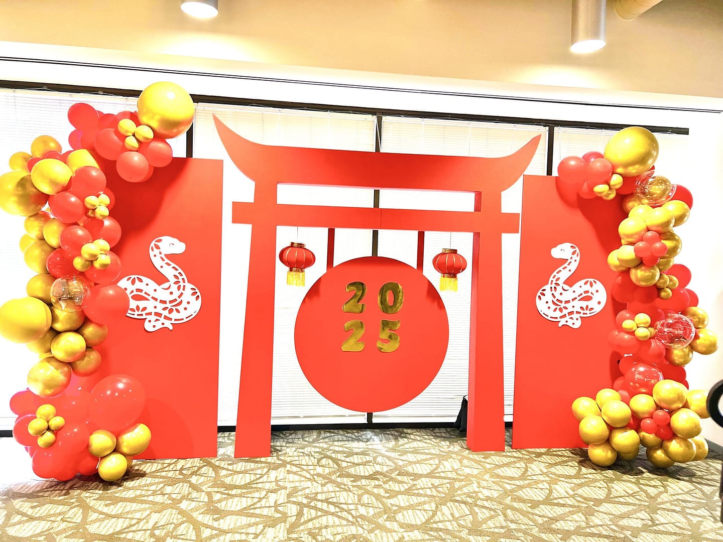 Party background for a Chinese New Year Celebration, with balloons that are red and gold by Mellow Events.