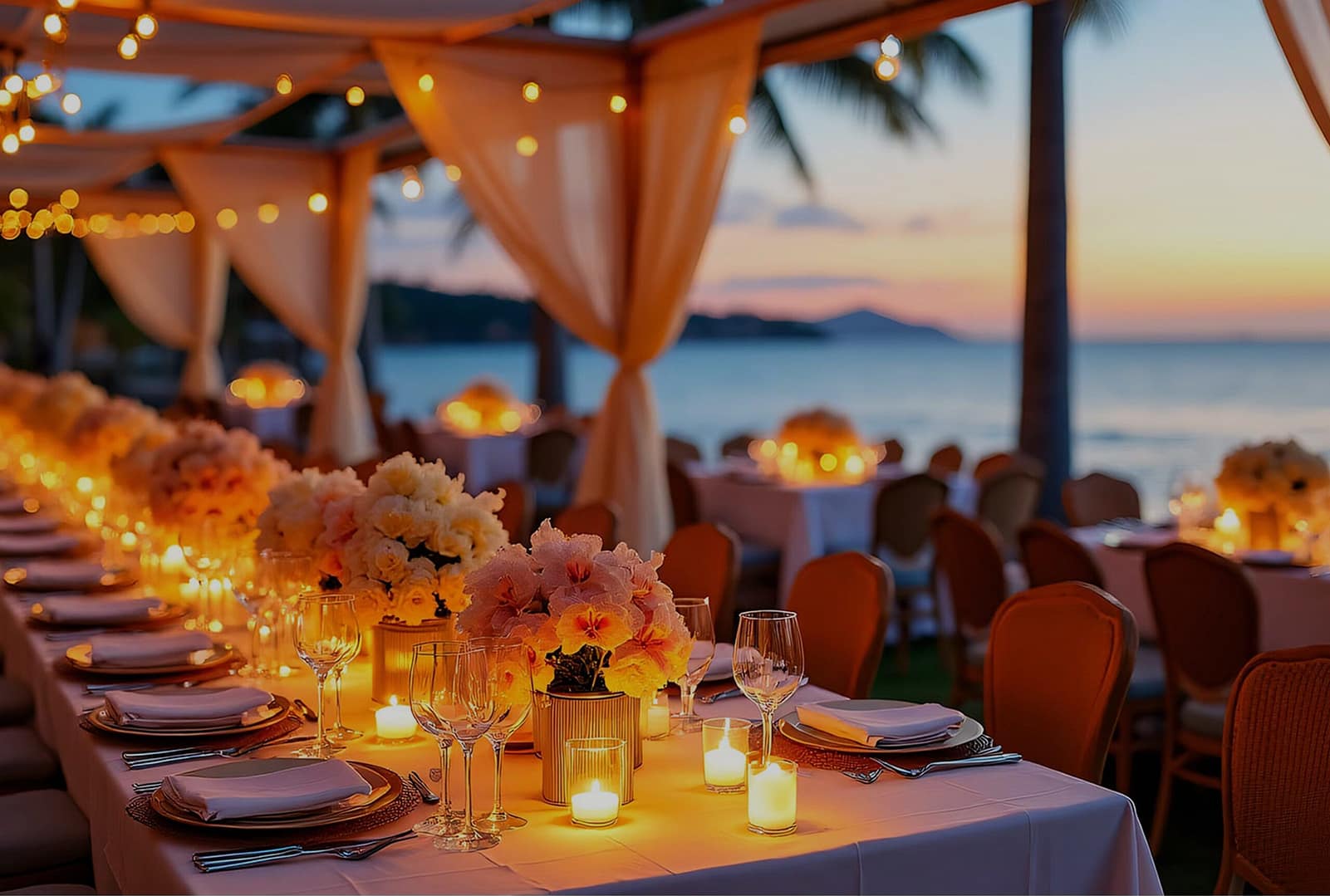 Wedding reception on the ocean wit lots of flowers